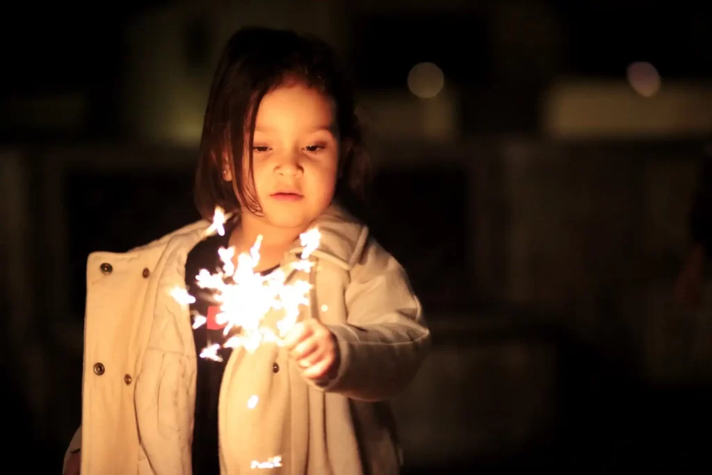 girl enjoying firework christmas in bali