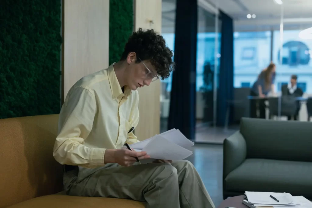 Man fill the form to get international driving license